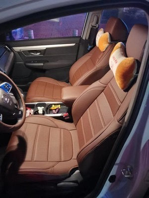 Front seats of Honda CR-V fitted with custom brown cowhide and microfiber leather seat covers