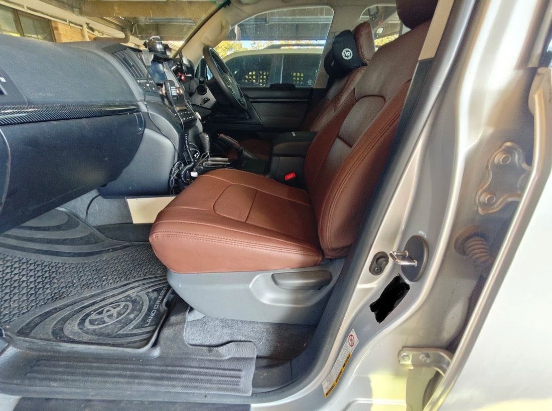Front seats of Toyota Landcruiser Prado fitted with brown cowhide fibre and microfibre leather seat covers