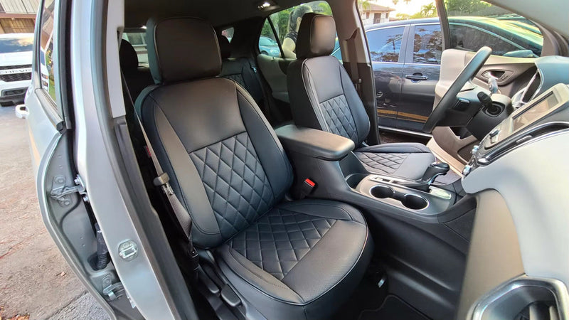 Front seats of Chevrolet Equinox 2021 with black custom Nappa leather seat covers showing diamond quilting